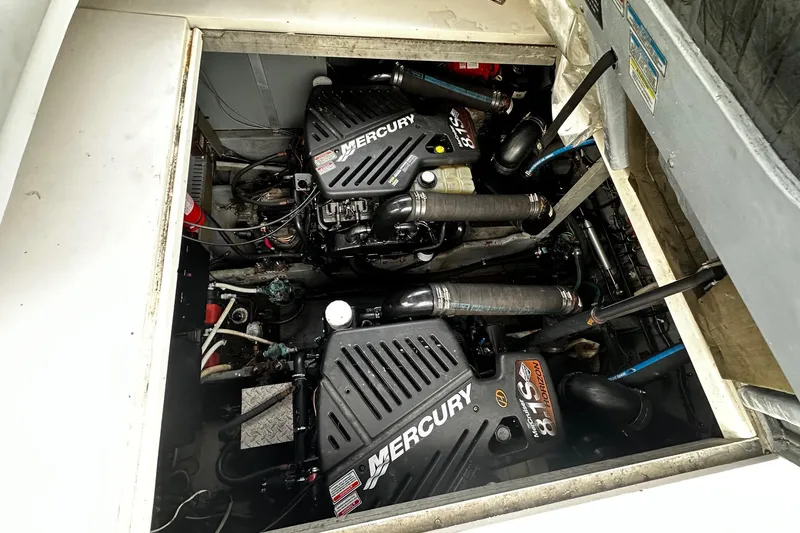 Slide: The Image of Engine compartment of a 2001 Sea Ray 380 Sundancer with twin Mercury engines. - 38