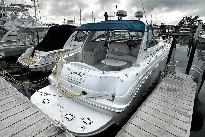 Slide: The Image of 2001 Sea Ray 380 Sundancer docked at marina, overcast sky, Riviera Beach, FL. - 4