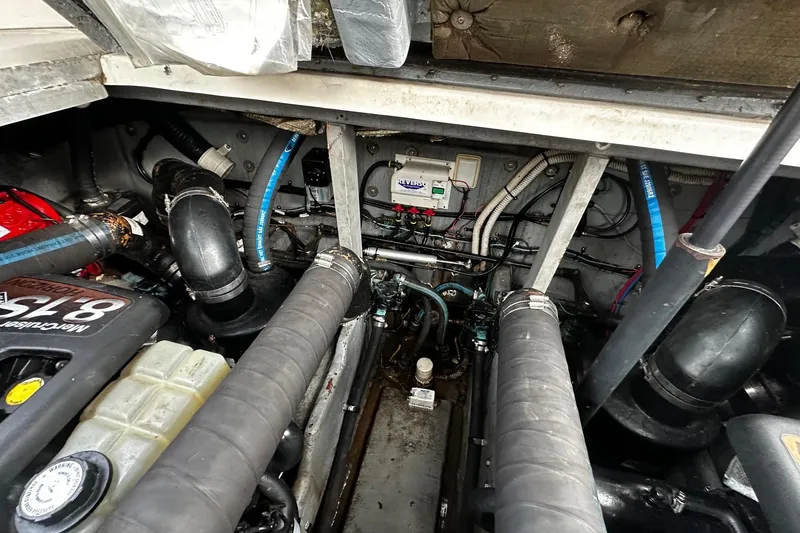 Slide: The Image of Engine compartment of a 2001 Sea Ray 380 Sundancer, showcasing mechanical components and wiring. - 40