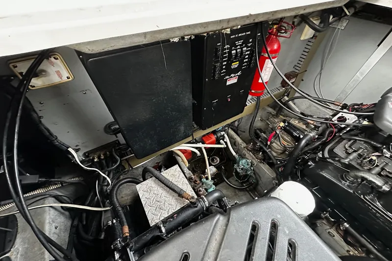 Slide: The Image of Engine compartment of a 2001 Sea Ray 380 Sundancer with electrical panel and fire extinguisher. - 41