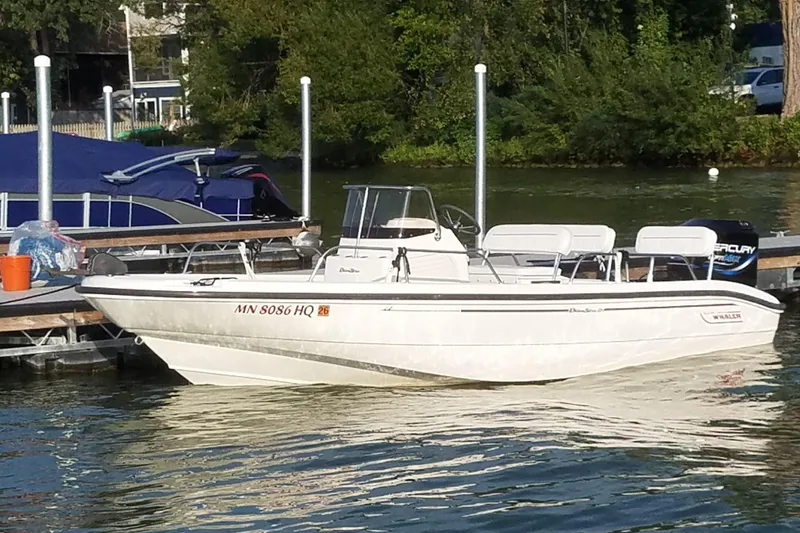 The Image of 1999 Boston Whaler 180 Dauntless boat docked on a sunny day. - 0