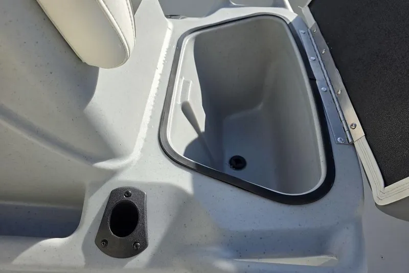 Slide: The Image of 2026 Tracker Bass Tracker Classic CC boat storage compartment and rod holder. - 10