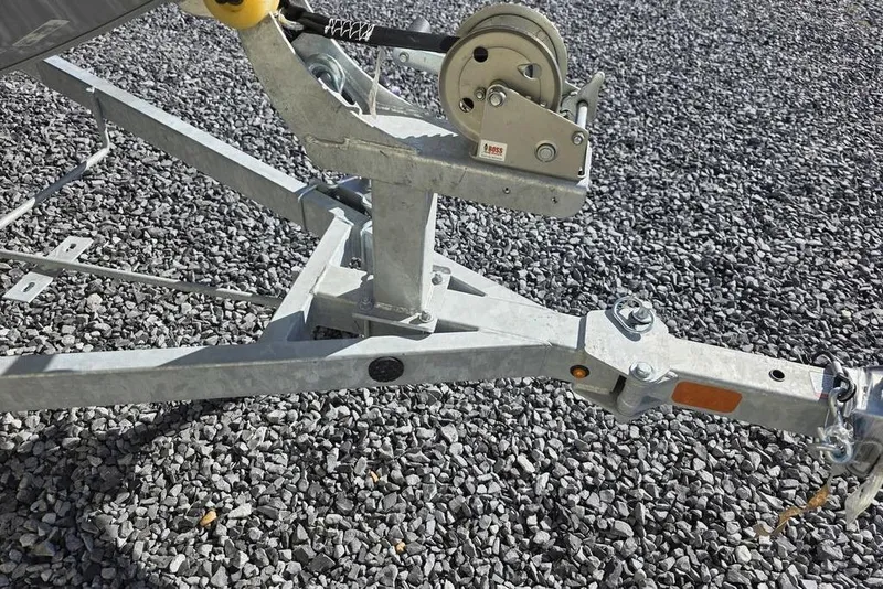 Slide: The Image of Trailer hitch of 2026 Tracker Bass Tracker Classic CC on gravel surface. - 17