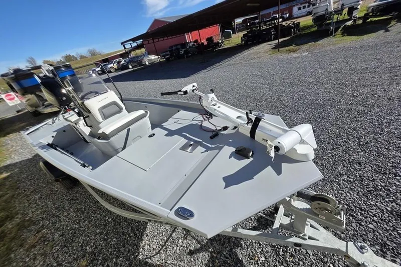 Slide: The Image of 2026 Tracker Bass Tracker Classic CC boat on gravel lot, featuring modern design and equipment. - 19