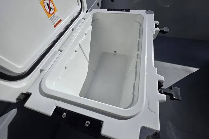 Slide: The Image of Open storage compartment in 2026 Tracker Bass Tracker Classic CC boat. - 23