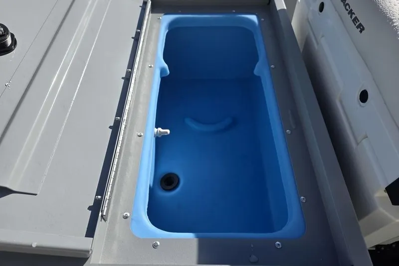 Slide: The Image of Livewell compartment in 2026 Tracker Bass Tracker Classic CC boat, featuring blue interior. - 4