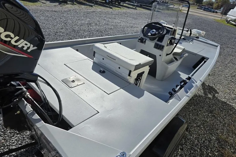 Slide: The Image of 2026 Tracker Bass Tracker Classic CC boat with Mercury engine, featuring spacious deck and console. - 5