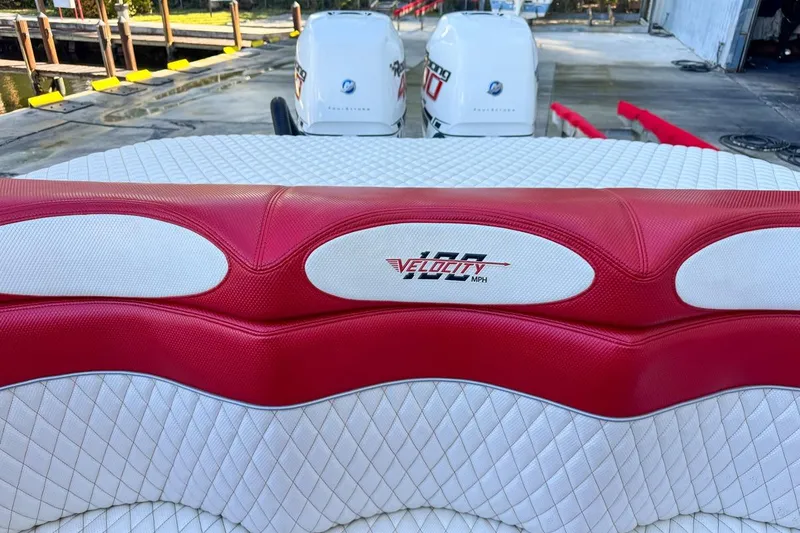 Slide: The Image of Red and white seating on 2022 Velocity 290sc boat with twin engines. - 101