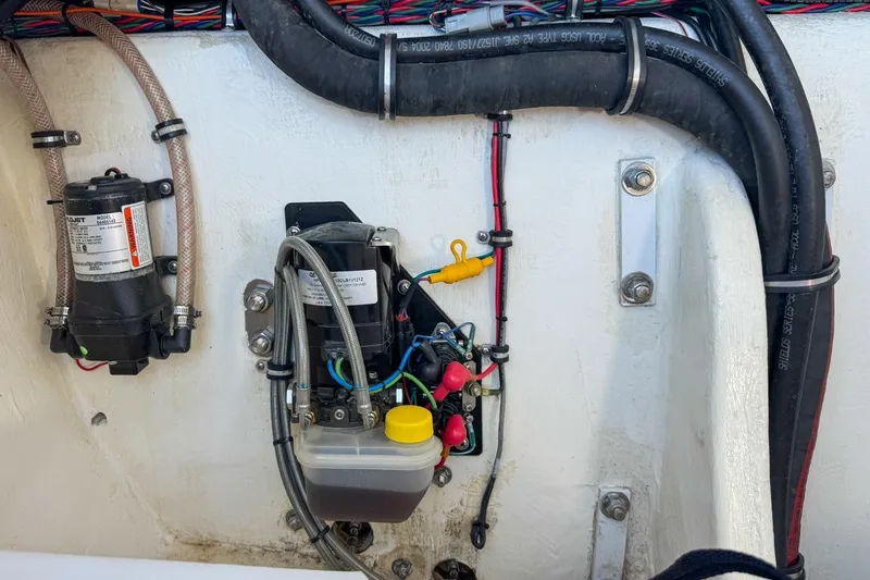Slide: The Image of Engine compartment of 2022 Velocity 290sc boat with wiring and components. - 110