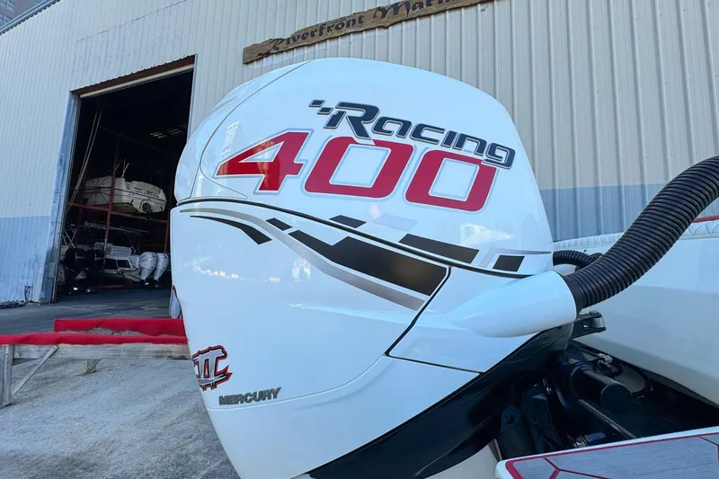 Slide: The Image of Mercury Racing 400 outboard engine on 2022 Velocity 290sc boat at marina. - 112