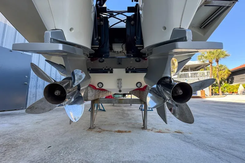 Slide: The Image of 2022 Velocity 290sc boat propellers, close-up view, showcasing dual outboard motors. - 113