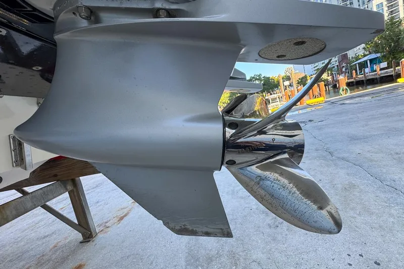 Slide: The Image of Close-up of a 2022 Velocity 290sc boat propeller on a dock. - 114