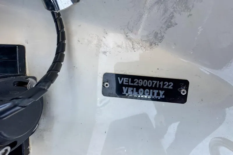 Slide: The Image of 2022 Velocity 290sc boat identification plate with serial number VEL290071122. - 116