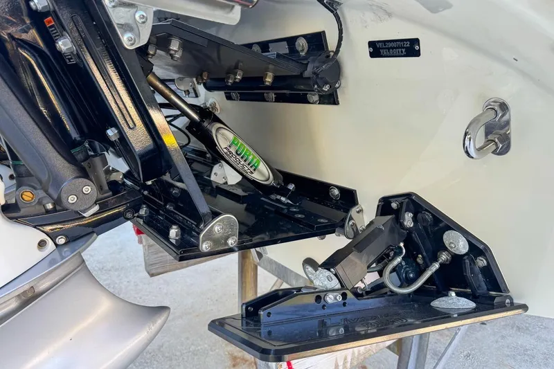 Slide: The Image of 2022 Velocity 290sc boat engine components and hydraulic system close-up. - 121