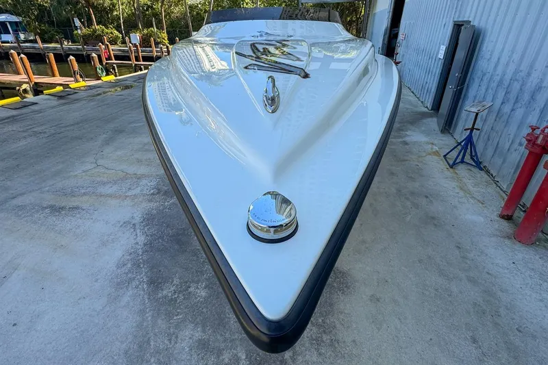 Slide: The Image of Front view of a 2022 Velocity 290sc boat on a concrete surface. - 16