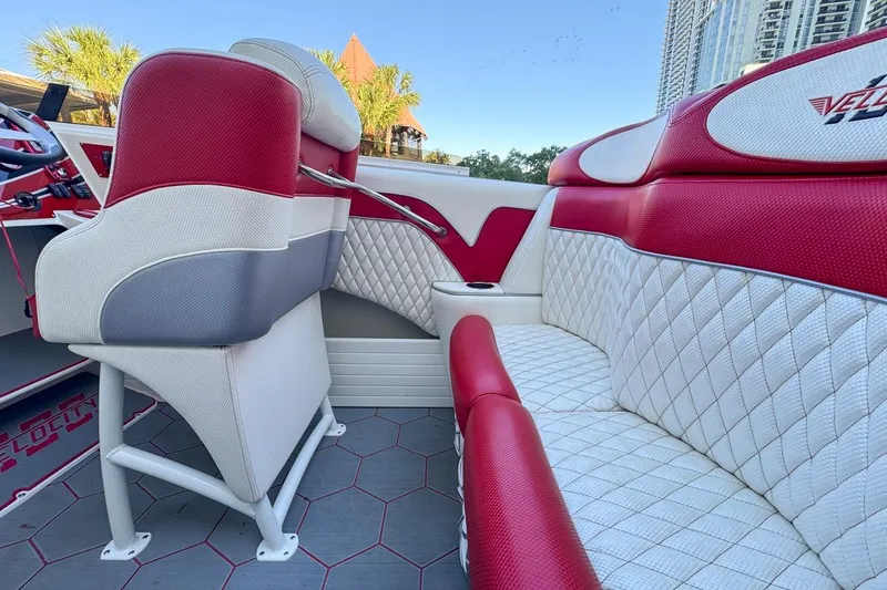 Slide: The Image of Interior of 2022 Velocity 290sc boat with red and white seating. - 30