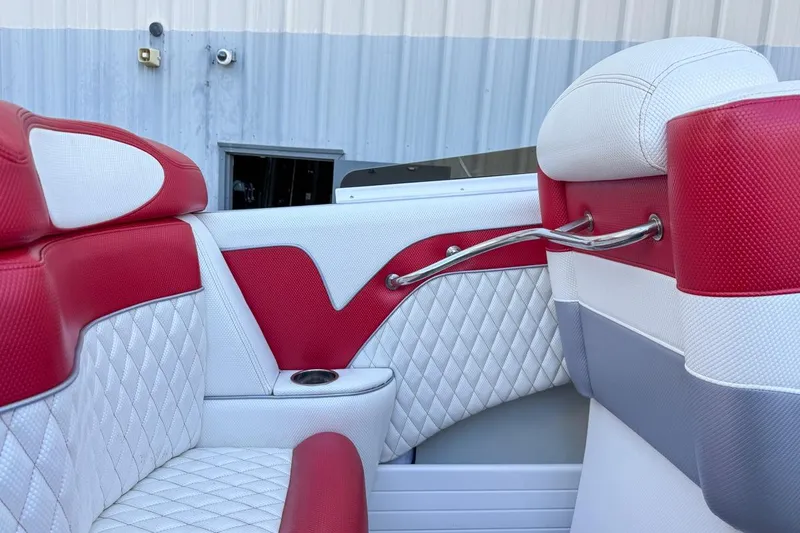 Slide: The Image of Red and white interior of 2022 Velocity 290sc boat with quilted seats. - 32