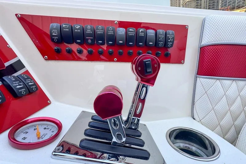 Slide: The Image of Control panel of 2022 Velocity 290sc boat with switches and throttle levers. - 46