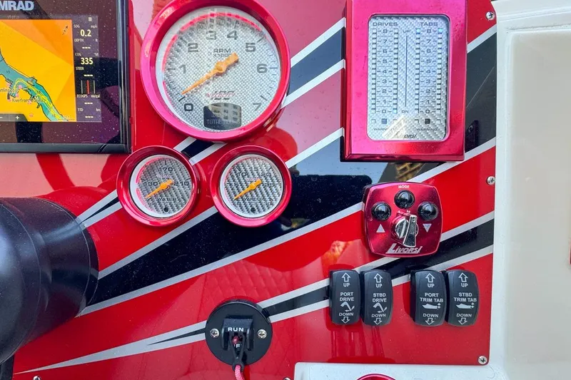 Slide: The Image of Dashboard of a 2022 Velocity 290sc boat with gauges and controls. - 47