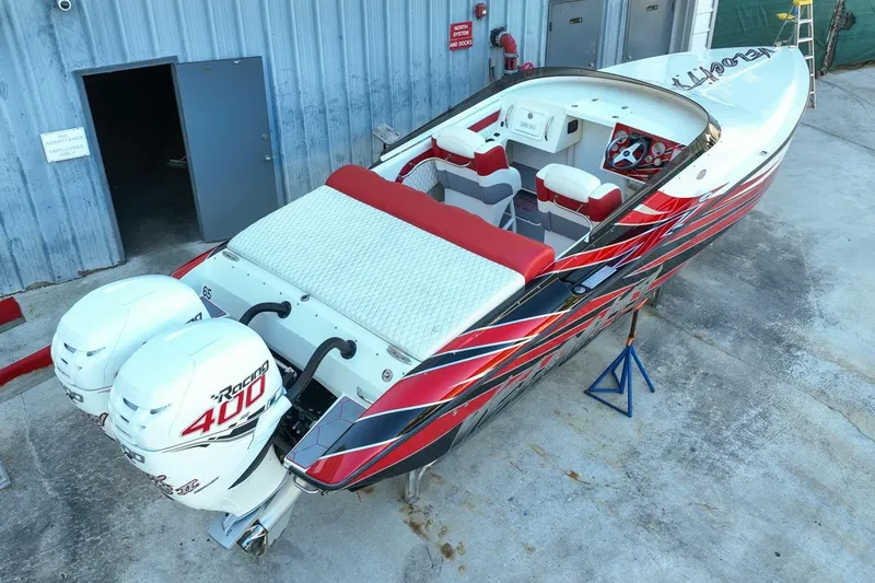Slide: The Image of 2022 Velocity 290sc speedboat with vibrant red and black design, dual Racing 400 engines. - 5
