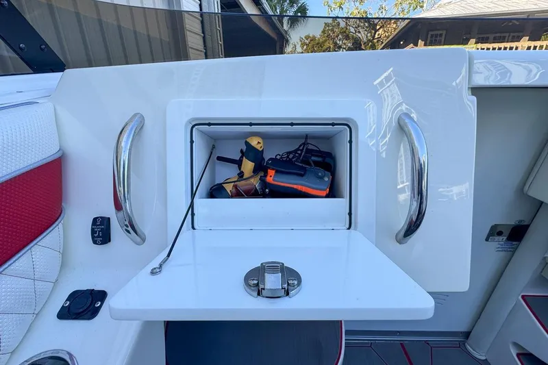 Slide: The Image of Storage compartment on 2022 Velocity 290sc boat with tools and equipment. - 50