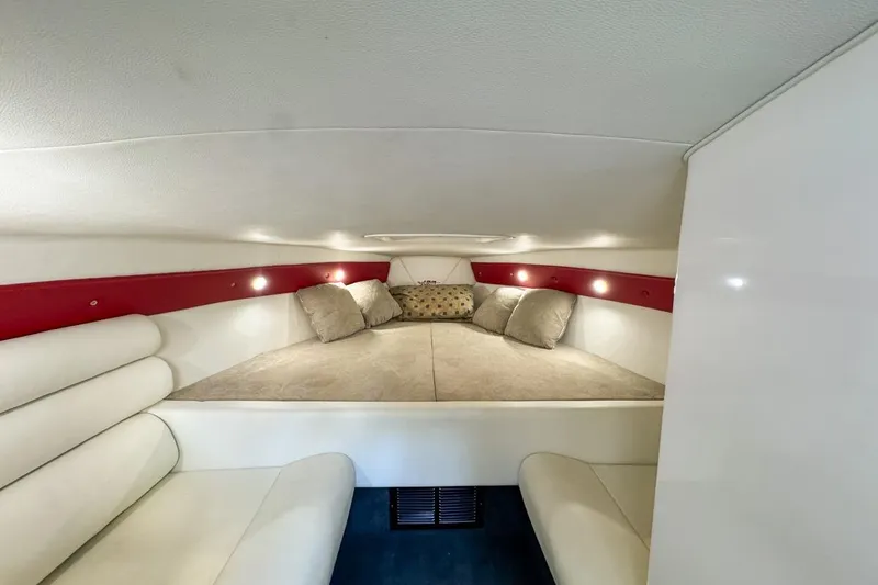 Slide: The Image of Interior cabin of 2022 Velocity 290sc boat with cozy seating and cushions. - 59