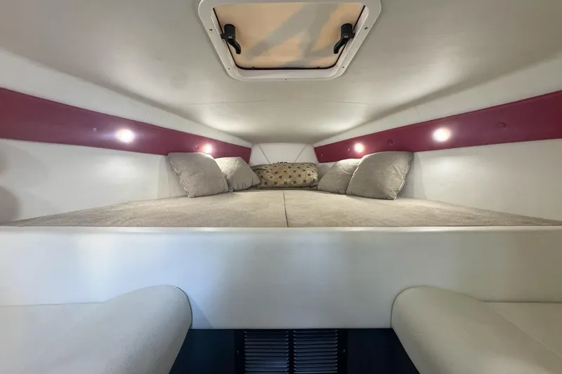 Slide: The Image of 2022 Velocity 290sc cabin interior with cozy bed and ambient lighting. - 60