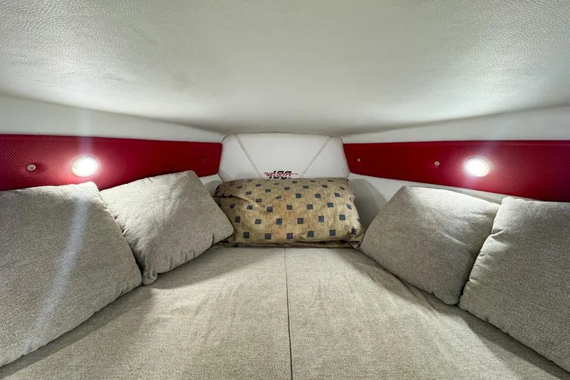 Slide: The Image of Cozy interior cabin of 2022 Velocity 290sc boat with cushions and ambient lighting. - 65