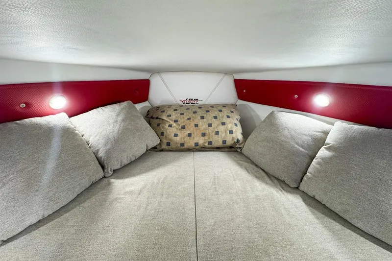 Slide: The Image of Cozy interior cabin of 2022 Velocity 290sc boat with cushions and ambient lighting. - 66