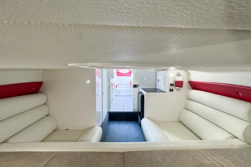 Slide: The Image of Interior of 2022 Velocity 290sc boat with white and red seating, compact design. - 68