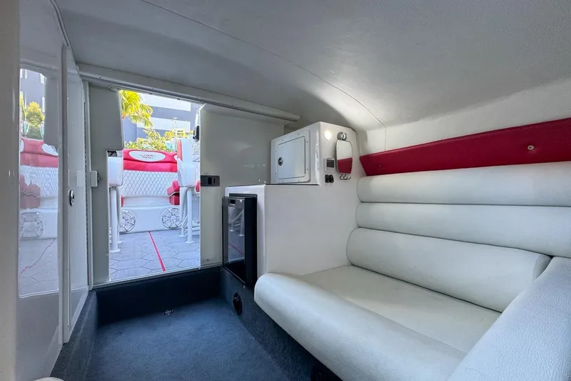 Slide: The Image of Interior of 2022 Velocity 290sc boat with white seating and modern amenities. - 74