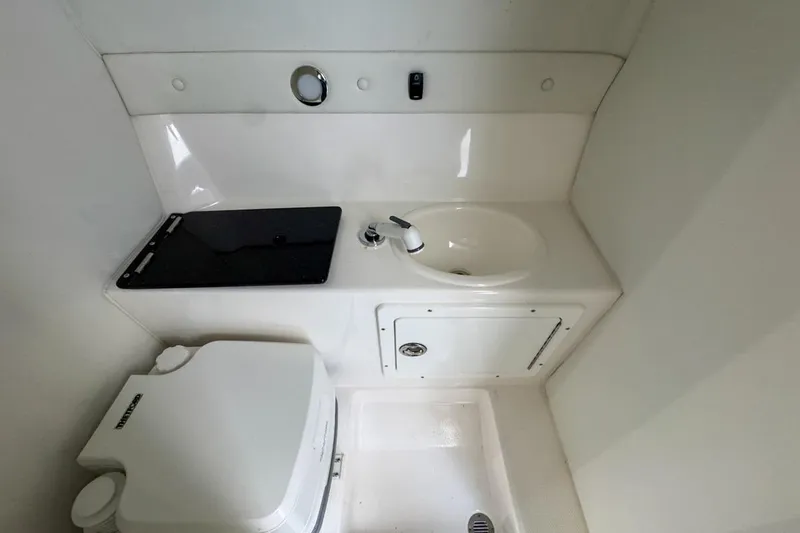 Slide: The Image of Compact bathroom in 2022 Velocity 290sc boat with sink and toilet. - 79