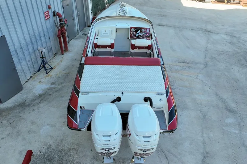 Slide: The Image of 2022 Velocity 290sc boat with dual engines, docked on concrete surface. - 8