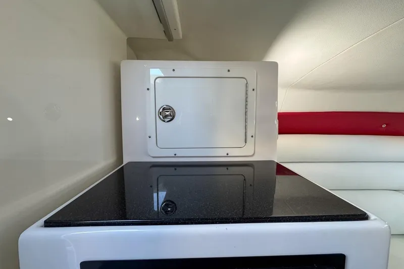 Slide: The Image of 2022 Velocity 290sc interior with sleek countertop and storage compartment. - 85