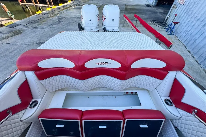 Slide: The Image of Red and white interior of 2022 Velocity 290sc boat with dual engines. - 96