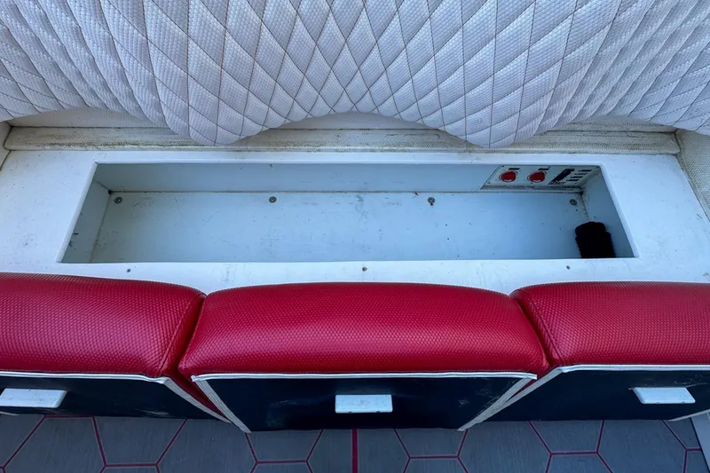 Slide: The Image of Red and white seating with storage compartment in 2022 Velocity 290sc boat. - 97