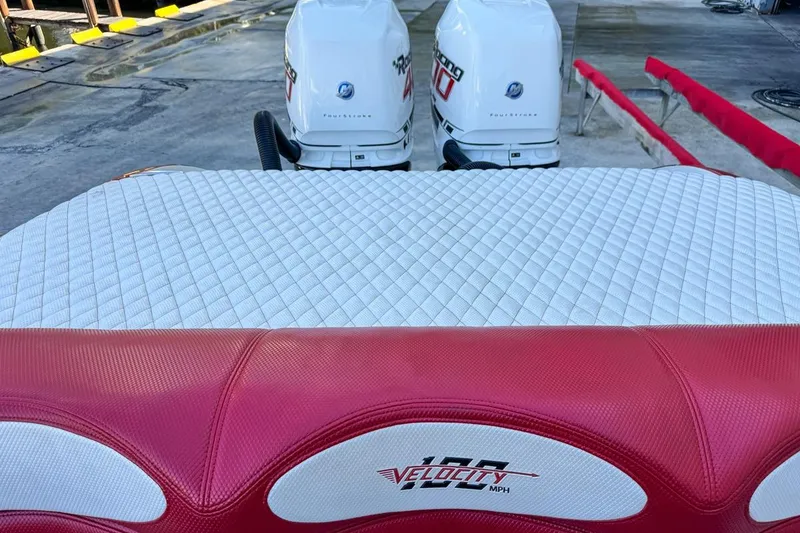 Slide: The Image of 2022 Velocity 290sc boat with dual outboard engines and quilted seating. - 99