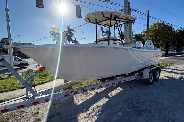 Slide: The Image of 2025 Sea Chaser 24 HFC boat on trailer under sunny sky. - 3