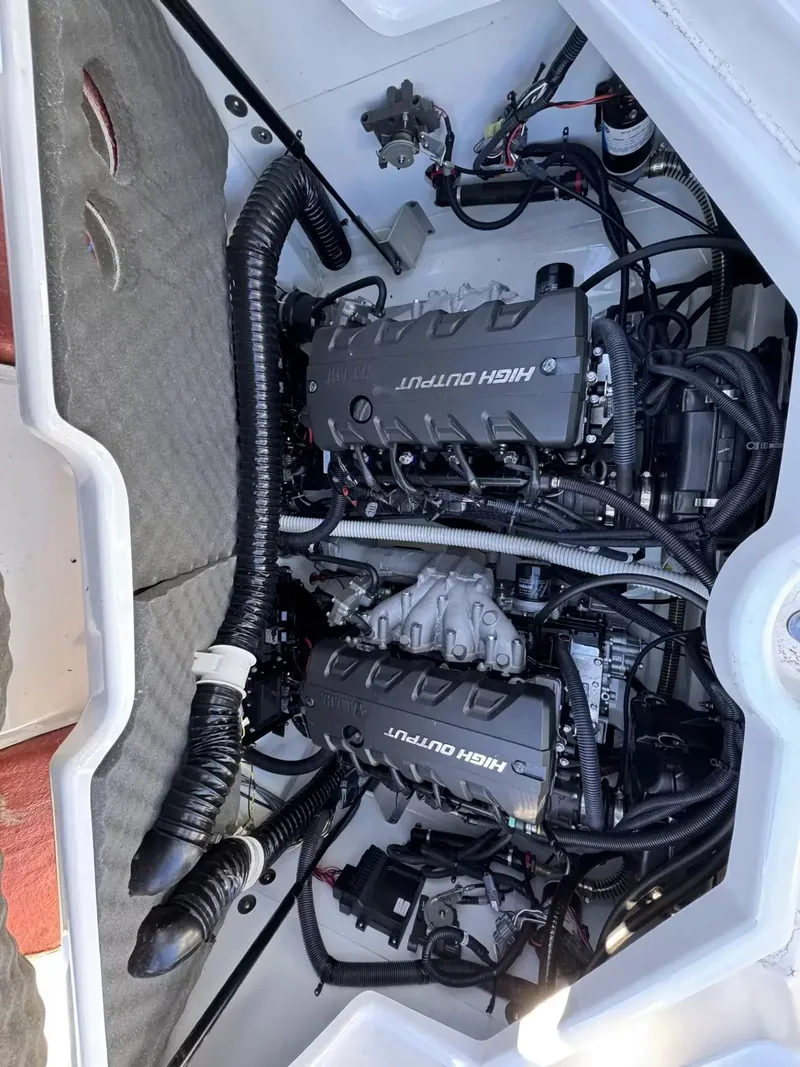 Slide: The Image of Engine compartment of a 2019 Yamaha Boats 212X with high-output engines. - 13