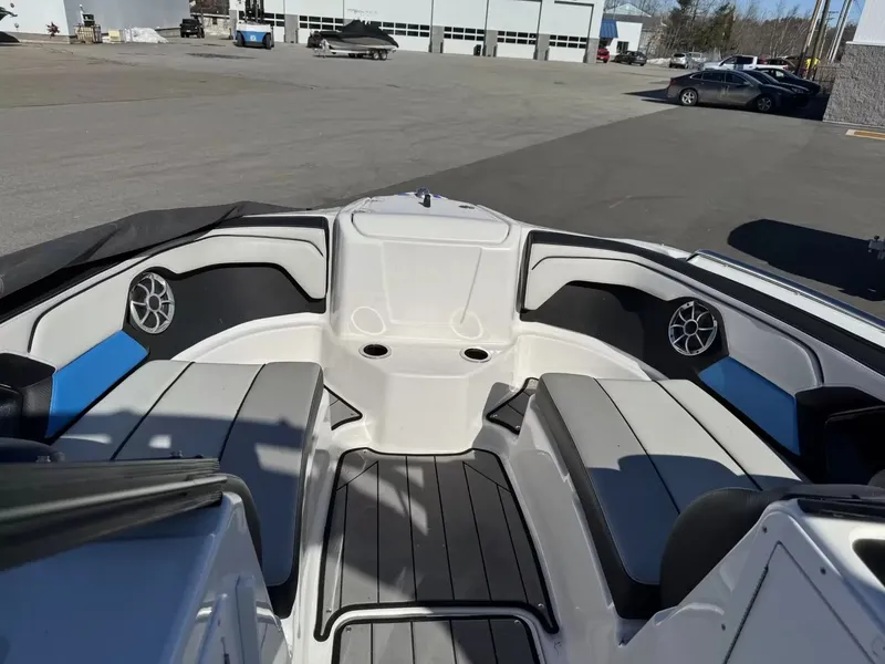 Slide: The Image of Interior of a 2019 Yamaha Boats 212X with seating and speakers. - 14