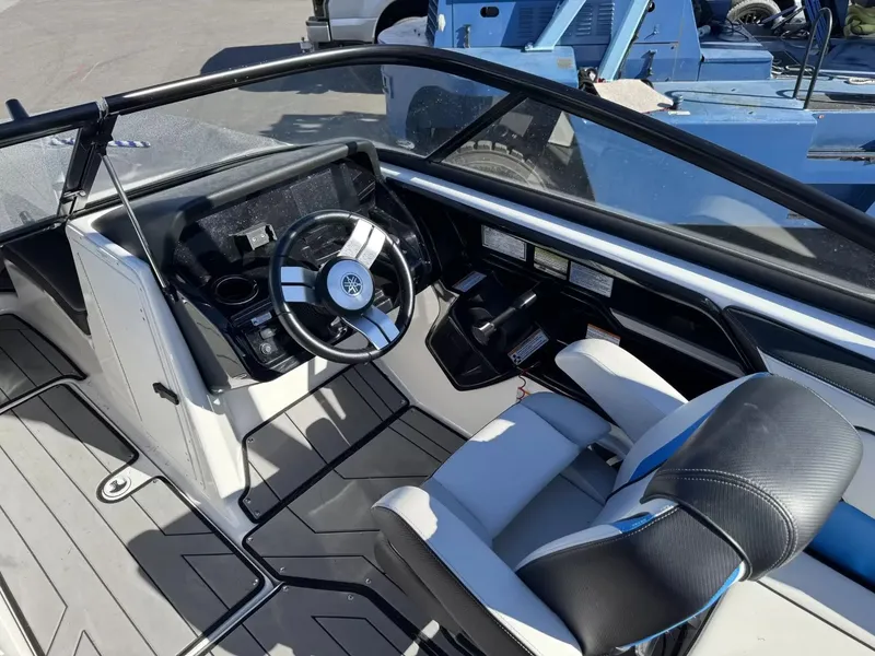 Slide: The Image of Interior of a 2019 Yamaha Boats 212X with steering console. - 15