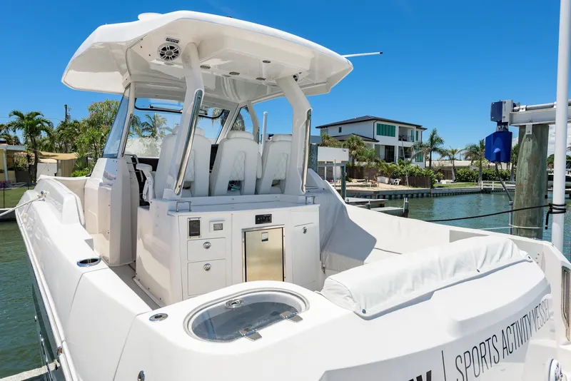 Slide: The Image of 2024 Regal 33 SAV boat docked, featuring sleek design and modern amenities. - 8