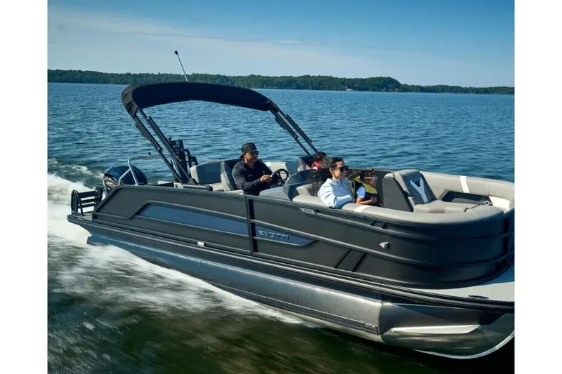 Slide: The Image of Manufacturer Provided Image: 2026 Evotti 521CS pontoon boat cruising on a serene lake with passengers. - 1