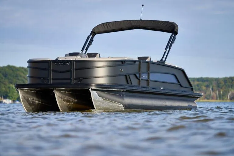 Slide: The Image of Manufacturer Provided Image: 2026 Evotti 521CS pontoon boat on a serene lake with lush green background. - 5