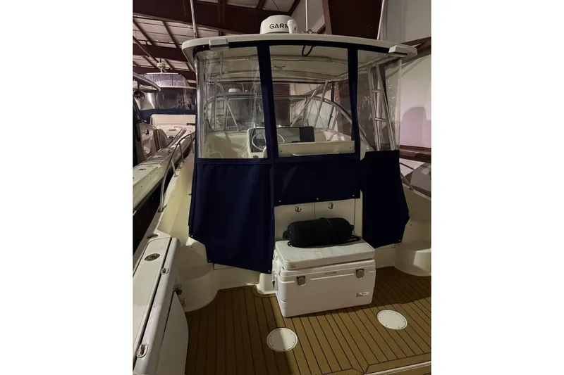 Slide: The Image of 2000 Pursuit 3070 Offshore Center Console boat with enclosed cockpit in storage. - 10