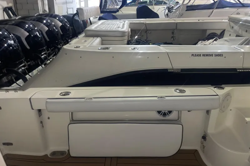 Slide: The Image of 2000 Pursuit 3070 Offshore Center Console boat interior with multiple outboard engines. - 17