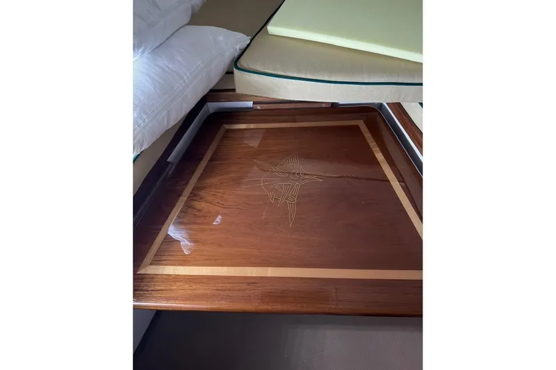 Slide: The Image of Wooden table with marlin inlay on 2000 Pursuit 3070 Offshore Center Console boat. - 23