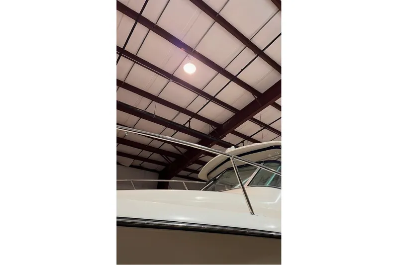 Slide: The Image of 2000 Pursuit 3070 Offshore Center Console boat in indoor storage facility. - 6