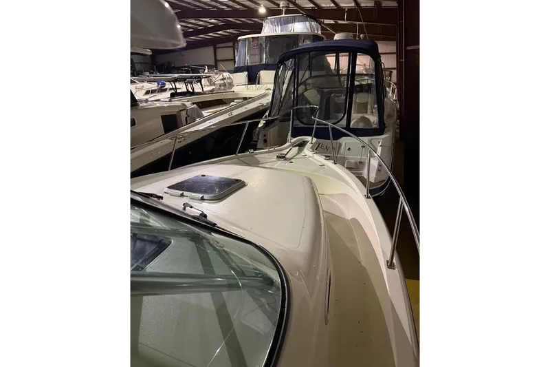 Slide: The Image of 2000 Pursuit 3070 Offshore Center Console boat in indoor storage facility. - 7