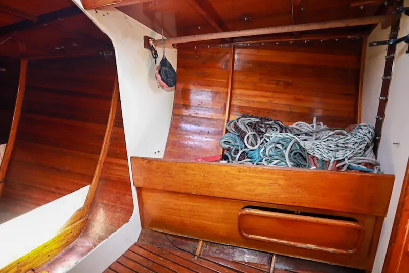 Slide: The Image of Interior of 1983 Nelson Marek 36 sailboat with wooden finish and coiled ropes. - 14